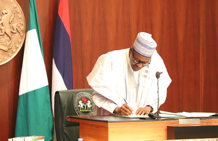Buhari signs amended constitution to allow states generate, transmit electricity